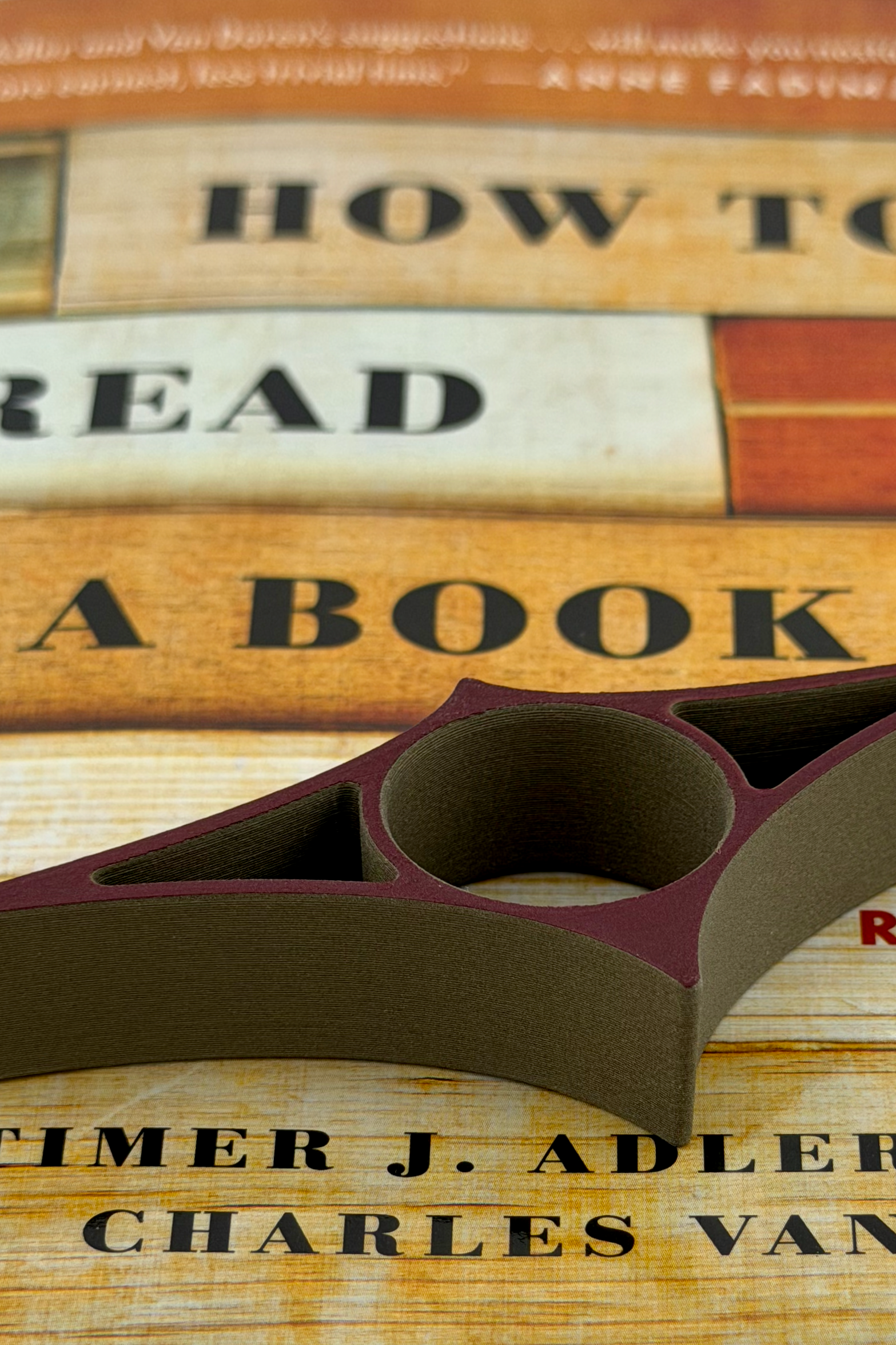 A Reading Ray sitting on top of a closed book.